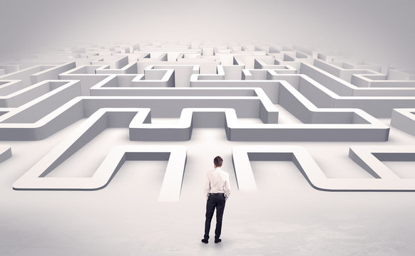 Businessman getting ready to enter a 3D flat labyrinth concept
