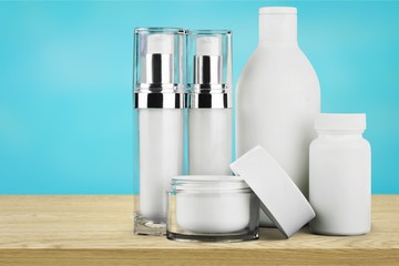 Cosmetic containers isolated on background