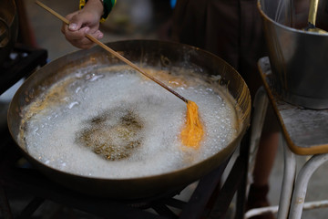 Thai sweetmeat made of egg yolk In the pan