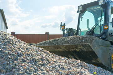 Crushed granite. Bucket typed by the loader.