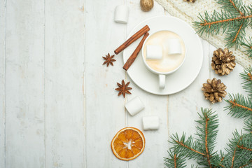 Christmas composition in Scandinavian style. Christmas gifts, coffee with marshmallows, pine cones, spruce branches on a wooden white background. Flat lay. view from above, place to copy. Banner