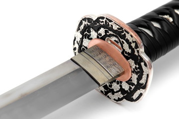 Tsuba: hand guard of Japanese sword isolated in white background