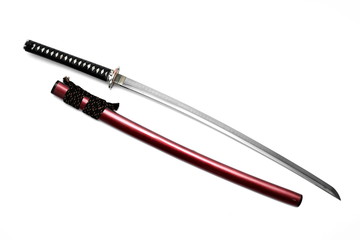 Japanese sword steel fitting and shiny red scabbard on white background.