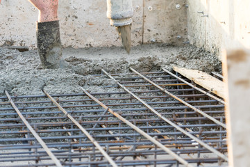 Workers pour the Foundation for the construction of a residential building.