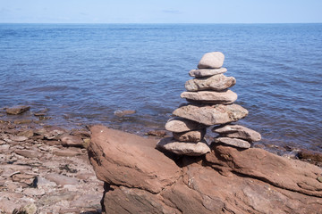 Inukshuk Standing Near the Shore in North Cape Prince Edward Island