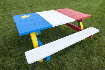 Picnic Table Painted with Colors of the Acadian Flag 