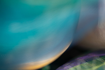Blurry extreme close up macro of chiffon fabric. Beautiful sensual shapes colorful background. Real...