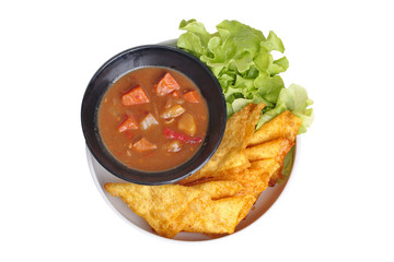 Crisy wonton with Japanese yellow curry topped green oak.