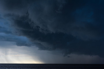 Rain strom cloudy darkness frightening sky in rainy season black dark color tone.