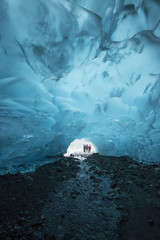 Hikers outside an Ice Cave in Juneau Alaska