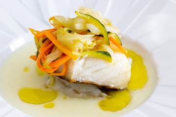 Cod dish with grilled vegetables. Traditional Portuguese dish.