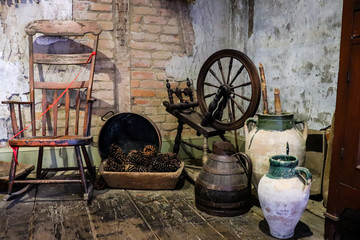 Interior view of abandoned blacksmith cottage with working equipment 