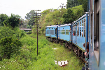 Obraz premium Tourists feeling happy along the way on the scenic blue train to Ella