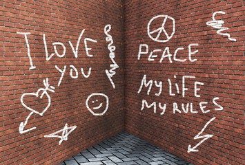 Corner of two high brick walls with various text and drawings drawn with chalk