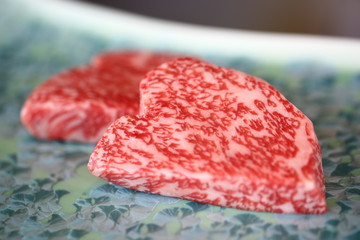 Marbling Grade 5+ Wagyu steak slices await grilling