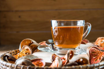 Bael tea juice on wooden table , healthy drink