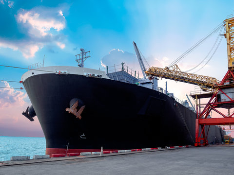 Vessel alongside at thailand port and loading bulk cargo.