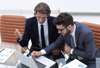 two business man working on laptop