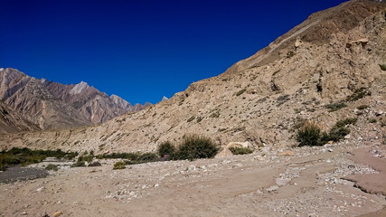 Trekking along the Braldu River in the Karakorum Mountains in Northern Pakistan, Landscape of K2 trekking trail in Karakoram range, Pakistan