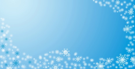 White snowflakes winter ornament on blue background with empty space for your text. Christmas card blank design template.