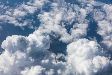 Cloudscape background. View out of an airplane window.