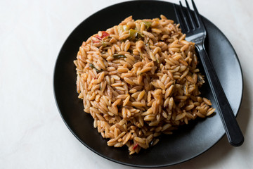 Turkish Style Cooked Orzo Pasta in Black Plate / Pilav or Pilaf.