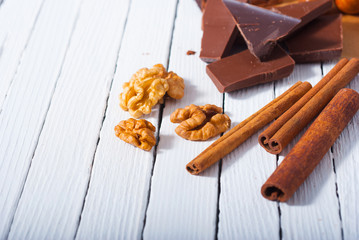 chocolate brownie cake  ingredients, baking papaer on white wood table background