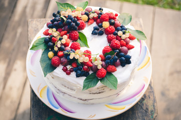 Bisquit cake with berries on top