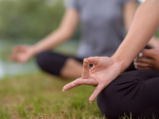 Obraz na płótnie Canvas women meditating and doing yoga exercise