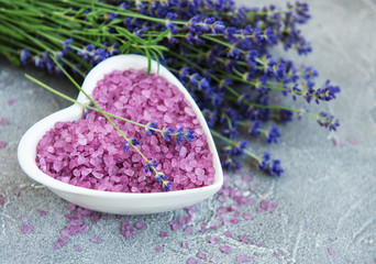 Obraz na płótnie Canvas Heart-shaped bowl with sea salt and fresh lavender flowers