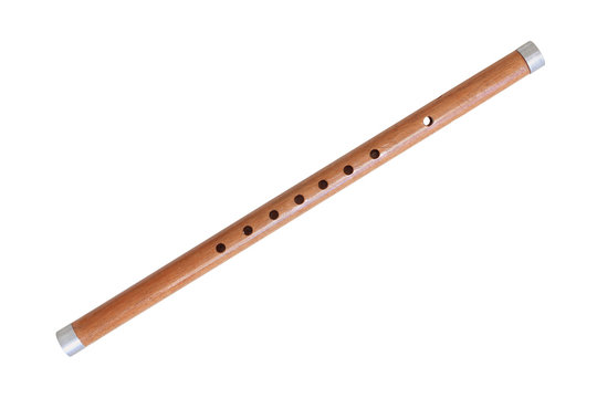 Wooden reed pipe or whistle isolated on white background