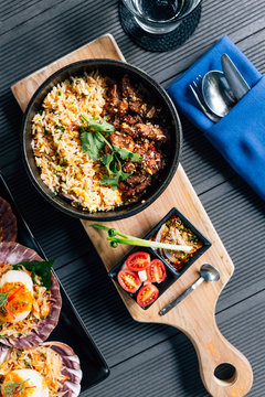 Top view of Thai style grilled pork fried rice served with Thai spicy dipping sauce.