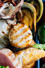 Seafood mixed grilled such as fish, squid, prawns, mussels and vegetables served with sweet and sour sauces.