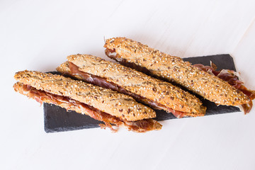 Bocadillo de jamon, spanish ham sandwich on a white background
