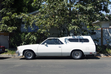 Fototapeta na wymiar Side view of a vintage classic American car in the street in LA