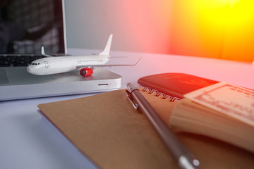 Laptop blank notebook, Blank name card, smartphone, passport, plane model