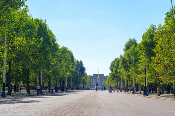 Tourists on The Mall looking southwest towards Buckingham Palace in summer, London