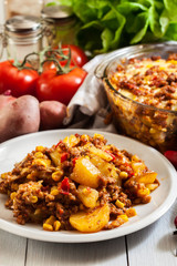 Portion of mexican potato casserole with minced meat