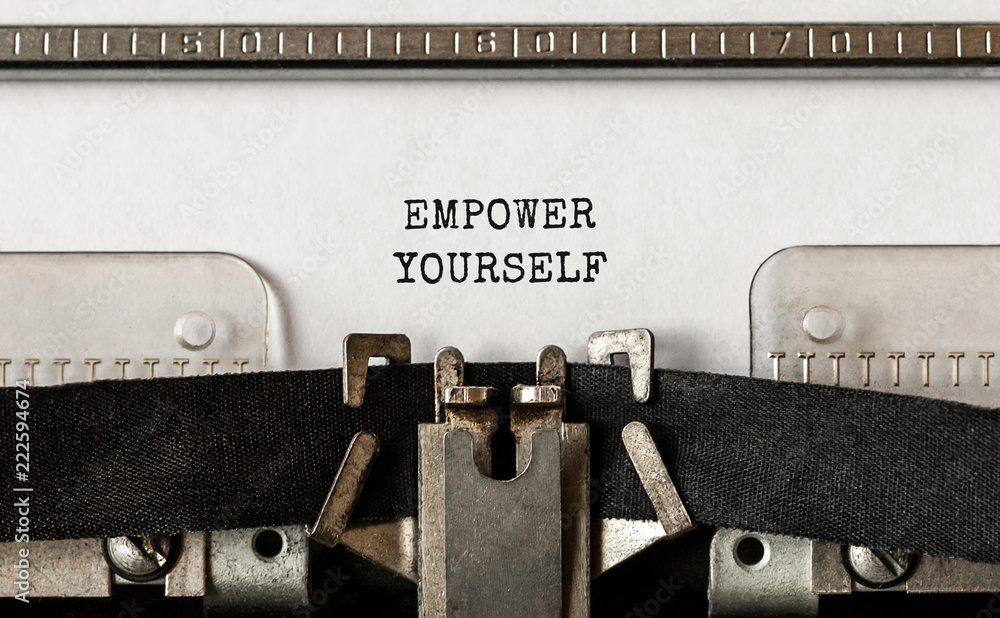 Poster text empower yourself typed on retro typewriter