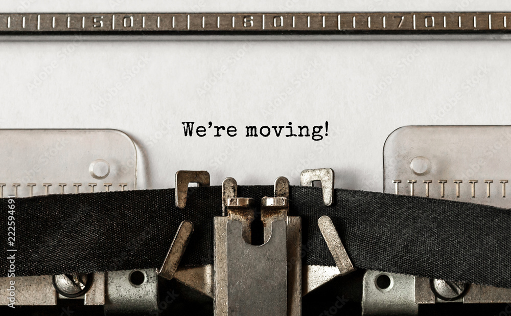 Fototapete text we are moving typed on retro typewriter