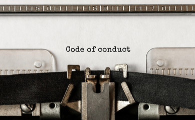 Text Code of conduct typed on retro typewriter