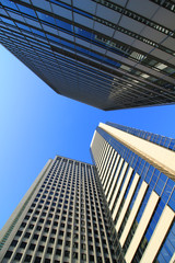 Fototapeta na wymiar High-rise building standing under the blue sky