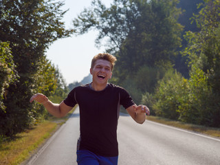 man jogging along a country road