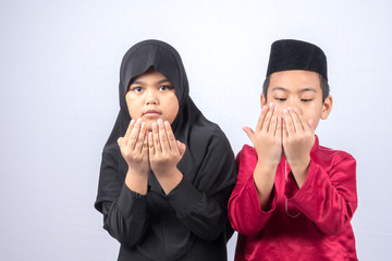Potrait of young asian muslim boy/girl isolated on white background.