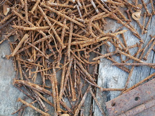 rusty nails and old wood background