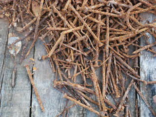 rusty nails and old wood background