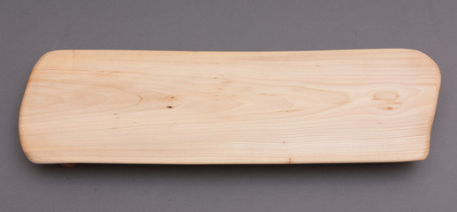 Ecological handmade wooden cutting board on grey background