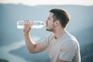 Young man drinking water