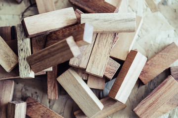Closeup image of wooden blocks of Jenga or Tumble tower game