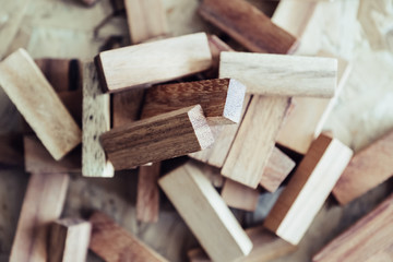Closeup image of wooden blocks of Jenga or Tumble tower game